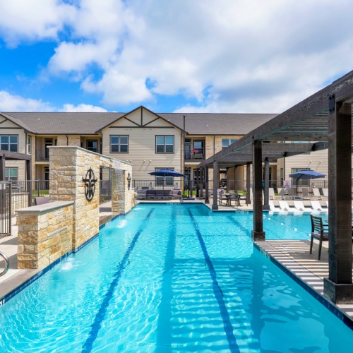 lap swimming pool with in-pool lounge chairs