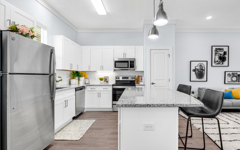 a photo of a kitchen with stainless steel appliances 