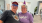 senior man and woman wearing birthday glasses and hats