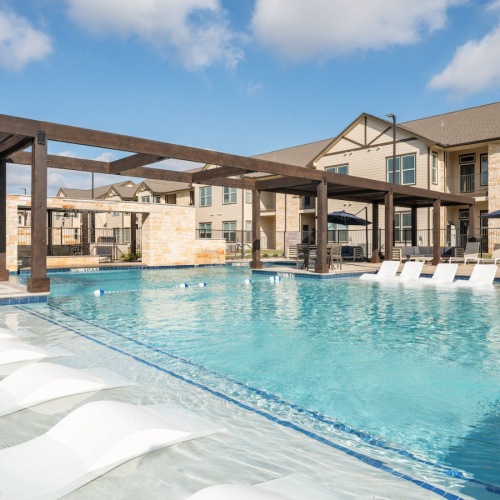 swimming pool with in-pool lounge chairs