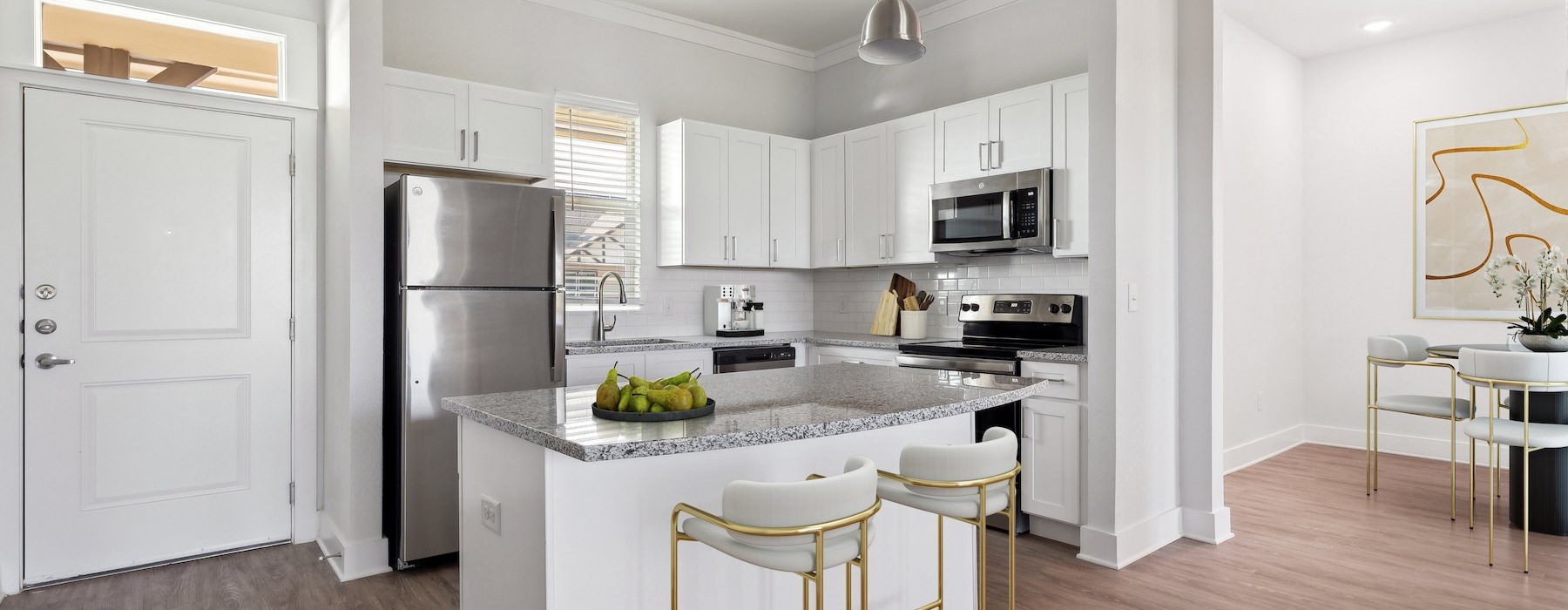 a kitchen with white cabinets